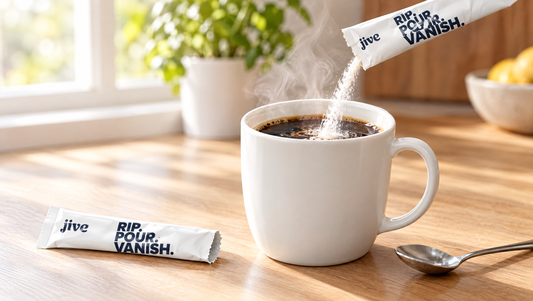 Jive creatine stick pack pouring into a mug of hot coffee